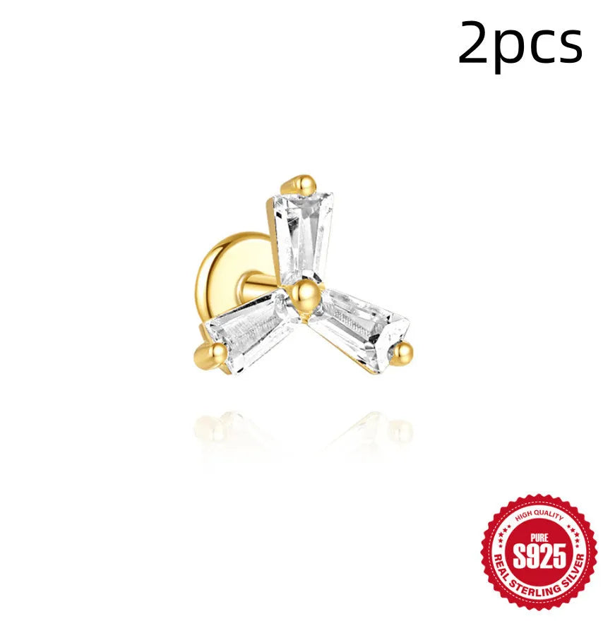 Golden geometric S925 sterling silver stud earrings with zircon inlays, showing clover, crown, and chain horse eye designs.