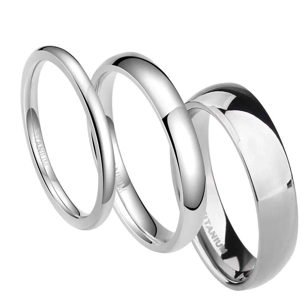Silver titanium steel ring on a finger, showing a simple band design.