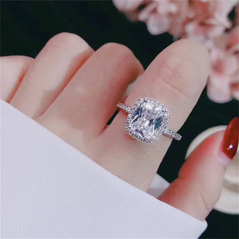 Silver alloy ring with artificial gemstone geometric inlay on white background