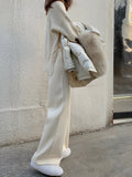 Women's knitted wide-leg high waist trousers in straight cut with drop hem design