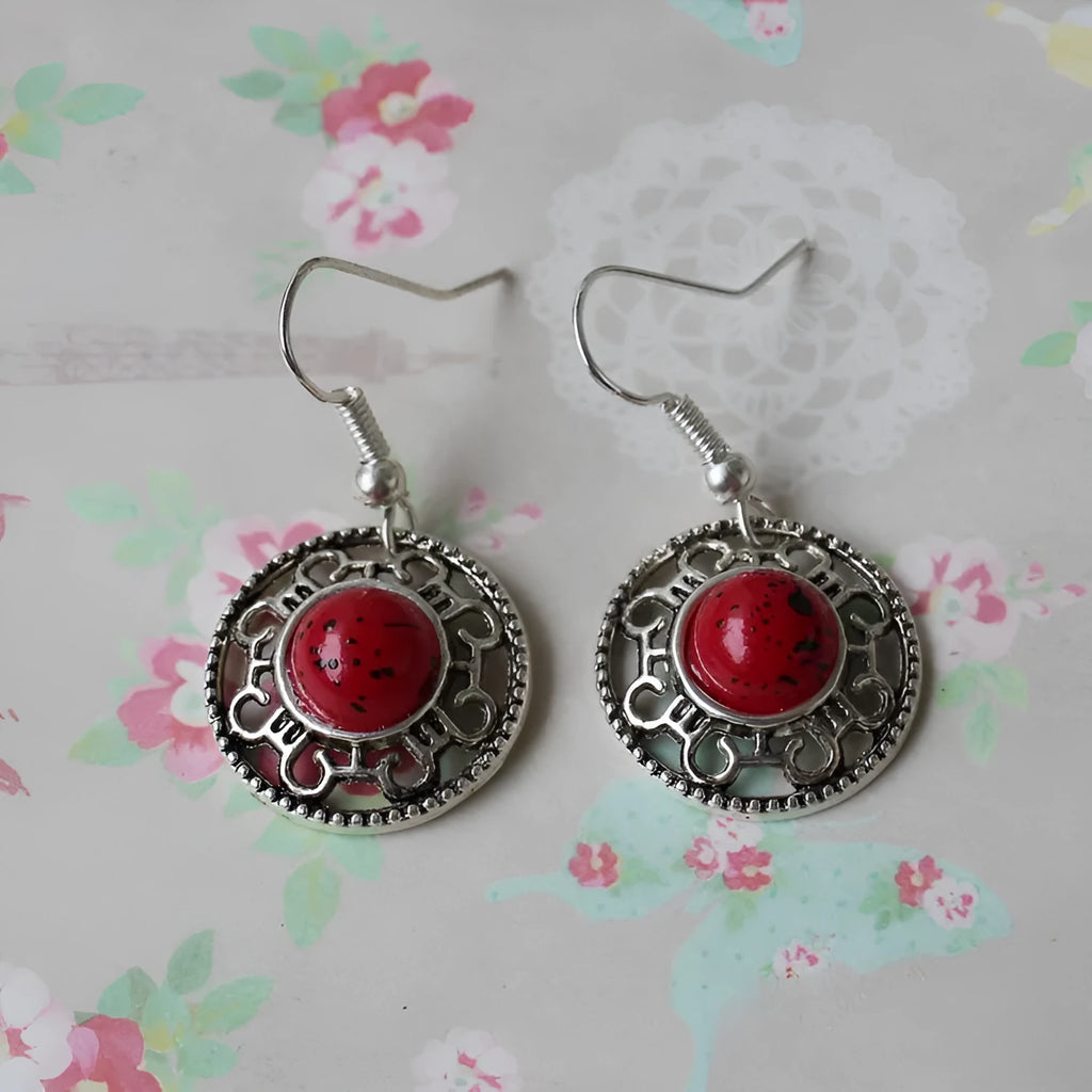 Geometric ethnic earrings with Tibetan silver and turquoise stones in traditional Miao style