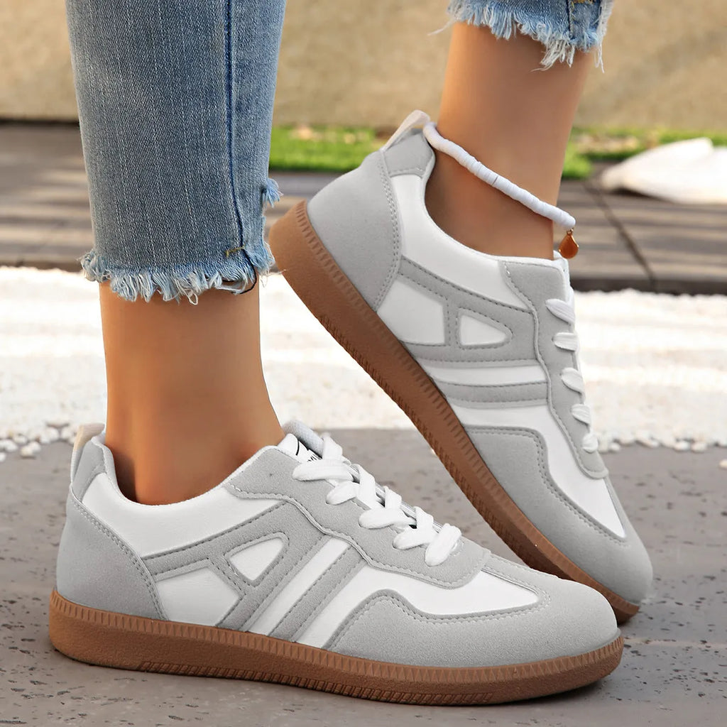 Women's retro colour matching lace-up trainers in black, grey or khaki with low heel platform and cross strap details