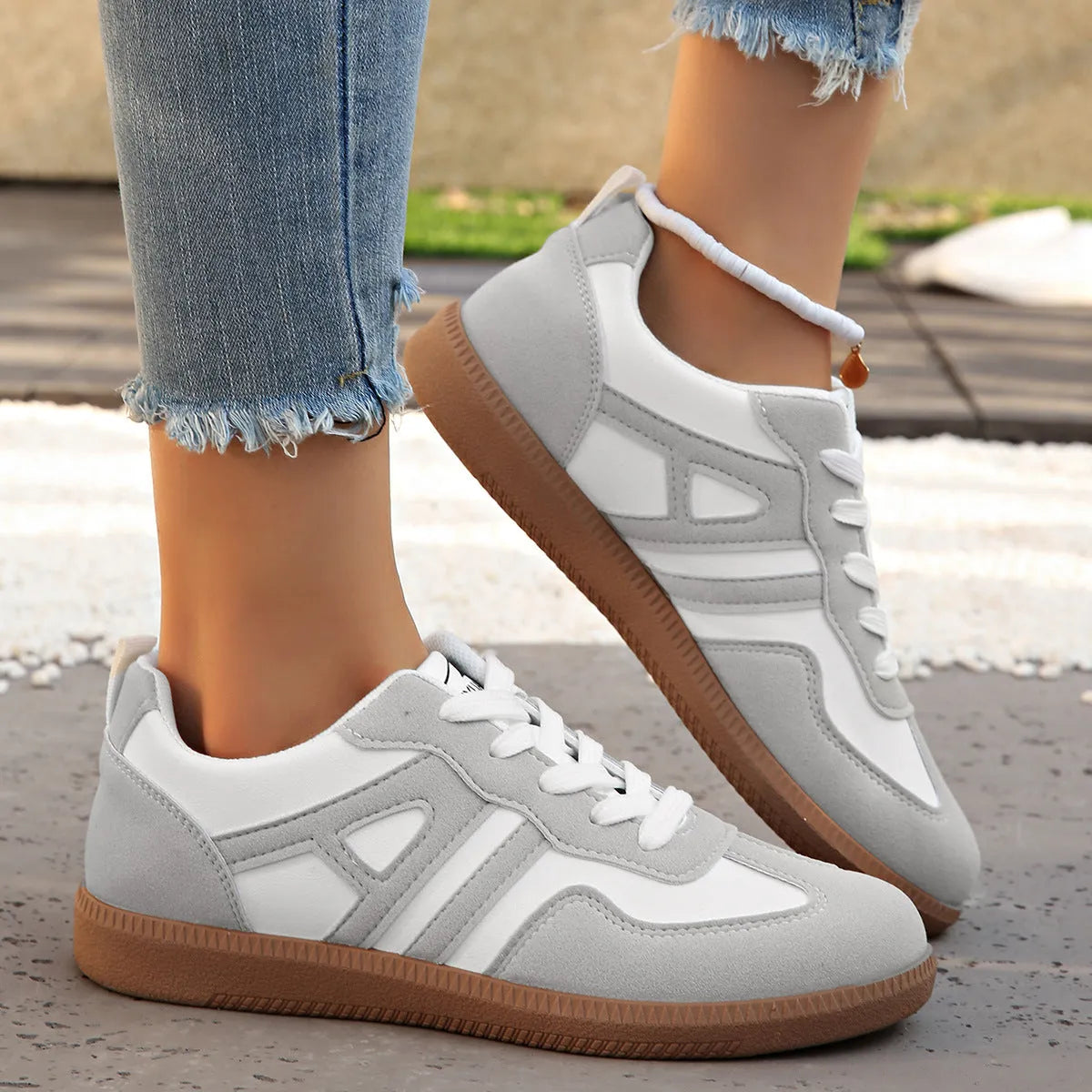 Women's retro colour matching lace-up trainers in black, grey or khaki with low heel platform and cross strap details