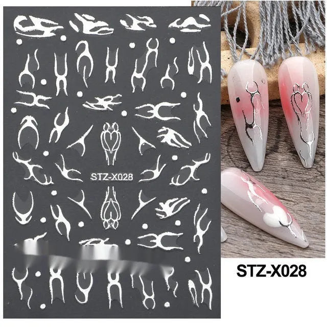 Sheet of black and silver strip nail art stickers with cartoon and love heart designs