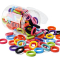 100 multicoloured seamless cotton baby hair ties in a jar, showing soft fabric and small 0.85-inch size.