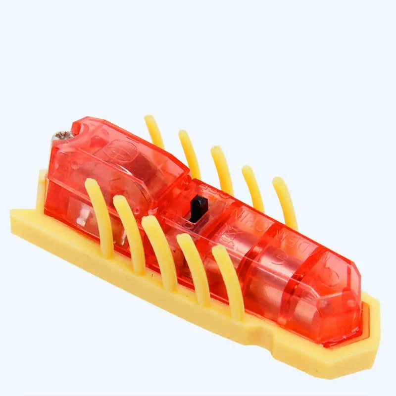 Small electric ladybug cat toy with 12 angular legs on hard floor surface