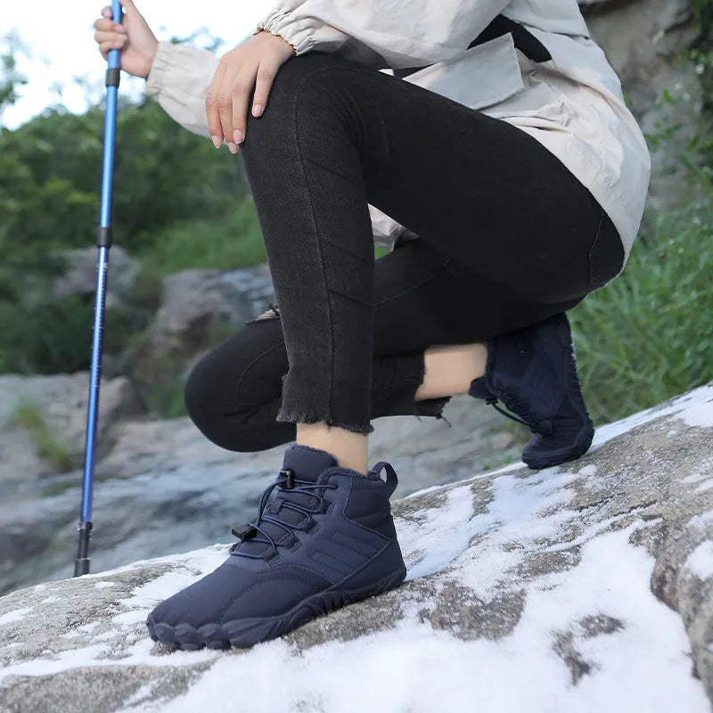 Outdoor winter slip-on boots for men and women with non-slip rubber sole, artificial plush lining, and waterproof Oxford cloth upper in black colour