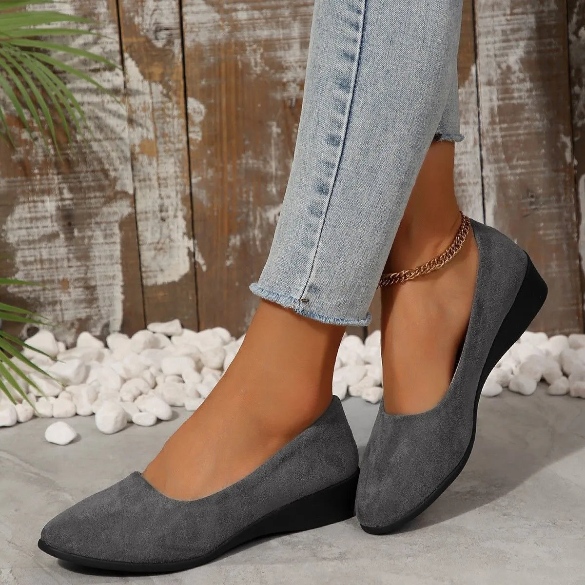 Women's suede wedge pump shoes in light brown with a low rubber sole and rounded toe.