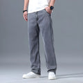 Men's loose straight-leg jeans in a lyocell-blend denim, shown in light blue colour with a zipper fly.