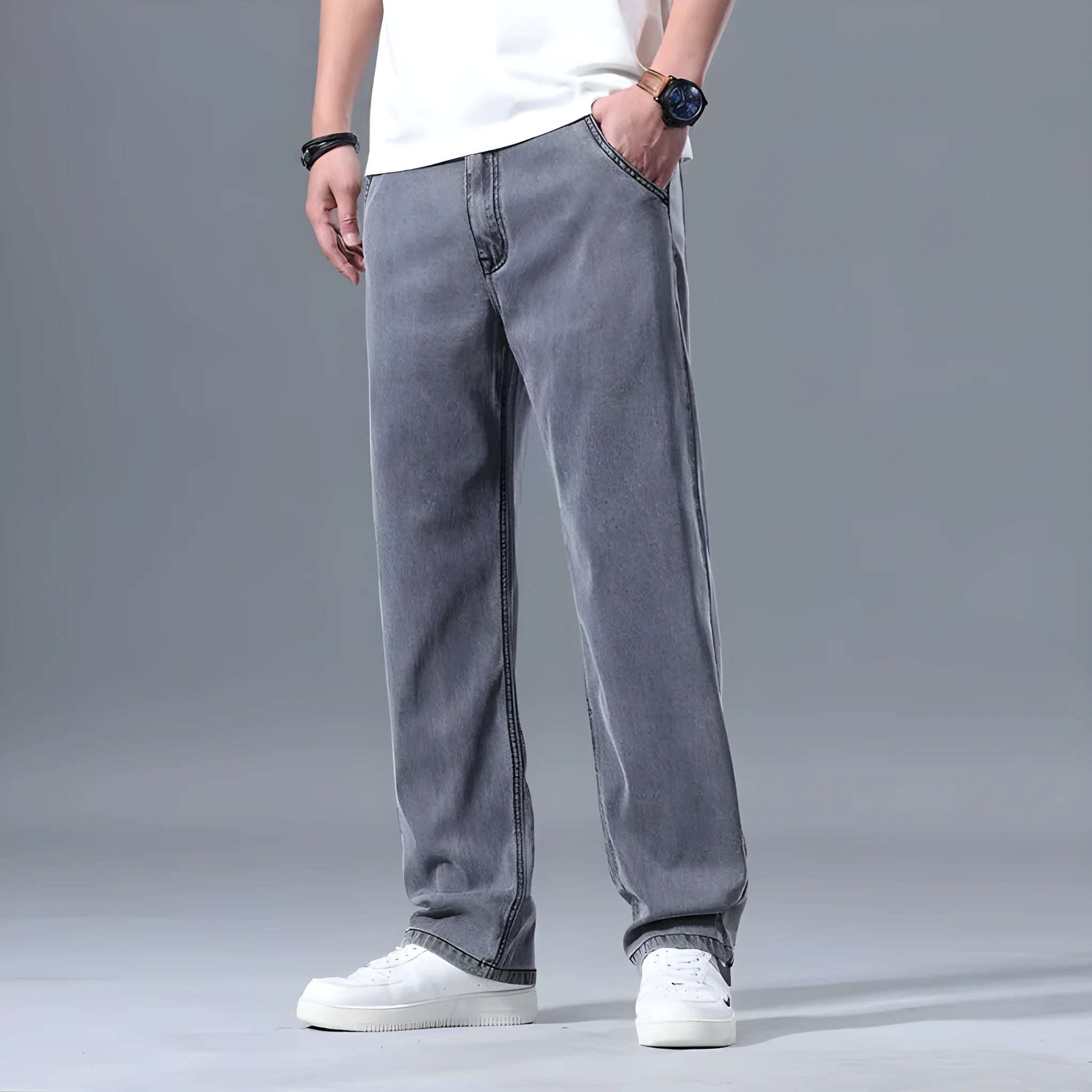 Men's loose straight-leg jeans in a lyocell-blend denim, shown in light blue colour with a zipper fly.