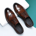 Men's black and brown brogue formal shoes with wingtip perforations, shown on a plain background.