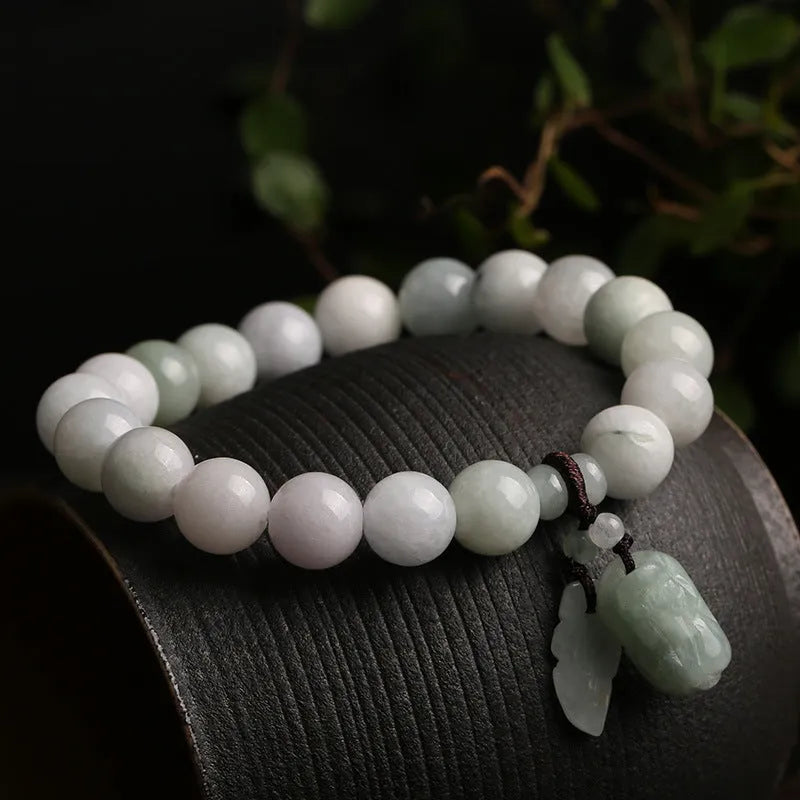 Green jade bracelet with geometric hanging beads and Maitreya Buddha charm