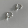 A pair of gold and white electroplated geometric star ear clips made from solid copper for women.