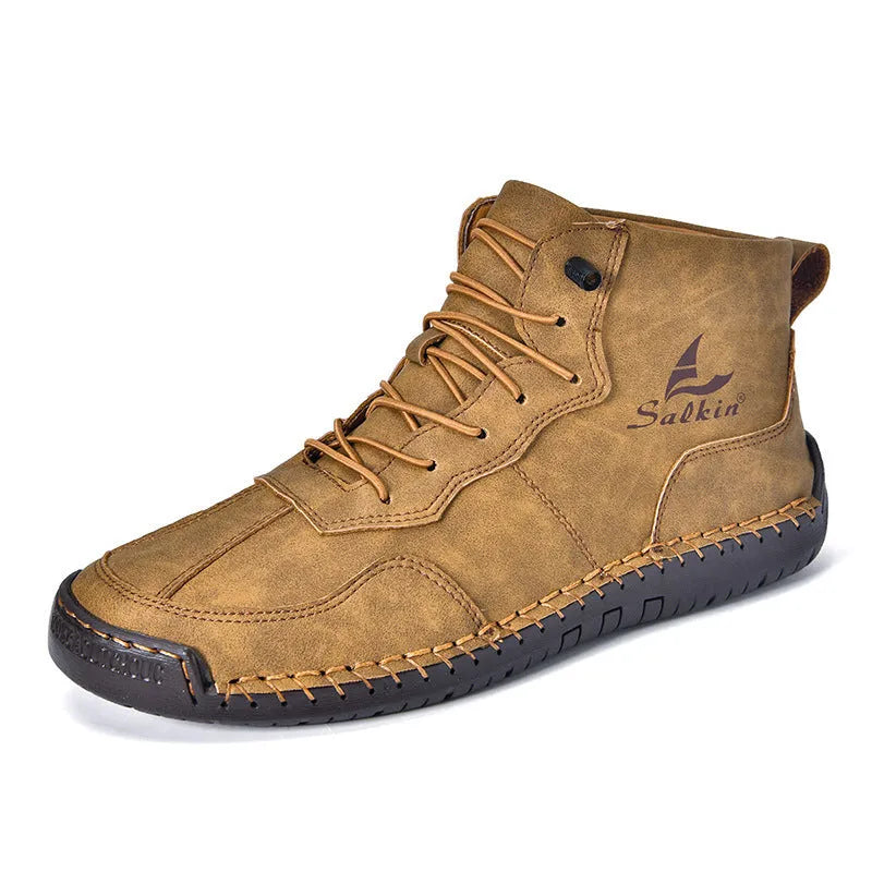 Casual high-top leather boots with elastic band closure and flat heel in beige colour with visible sewing detailing