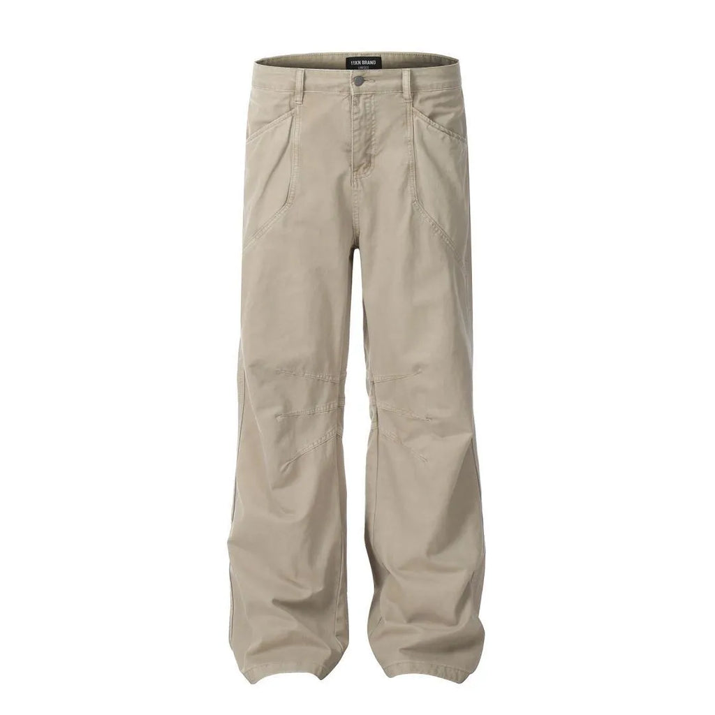 Man wearing brown loose fit high-waist straight leg cotton jeans trousers