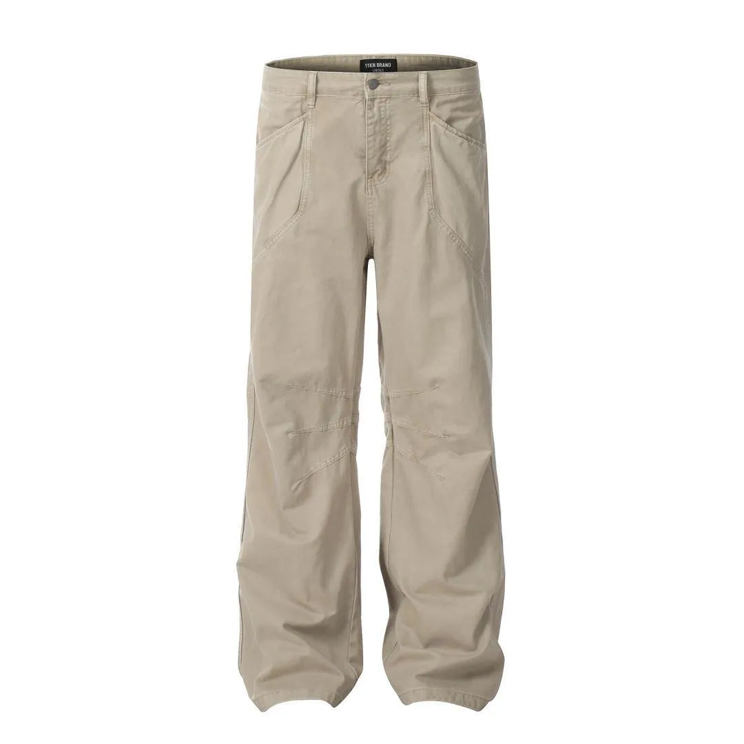 Man wearing brown loose fit high-waist straight leg cotton jeans trousers