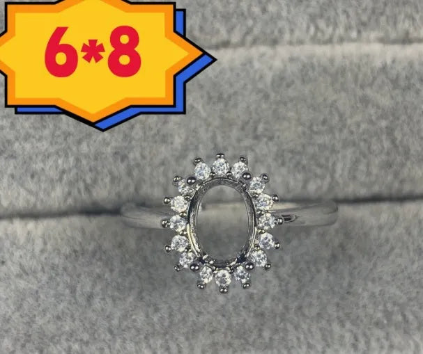 Open-mouth oval denier ring with a 6x8mm stone and five-pointed star decoration on a copper band.