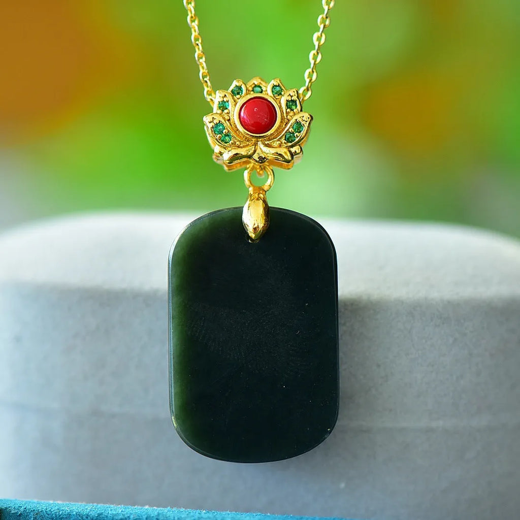 Copper inlaid natural Hetian gray and ink blue jade pendant necklace on a chain.