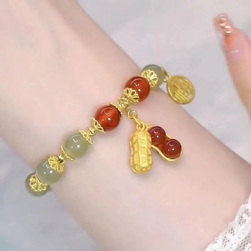Chinese style glass bracelet with bamboo joint details in a red Lvzhu Duobao design.