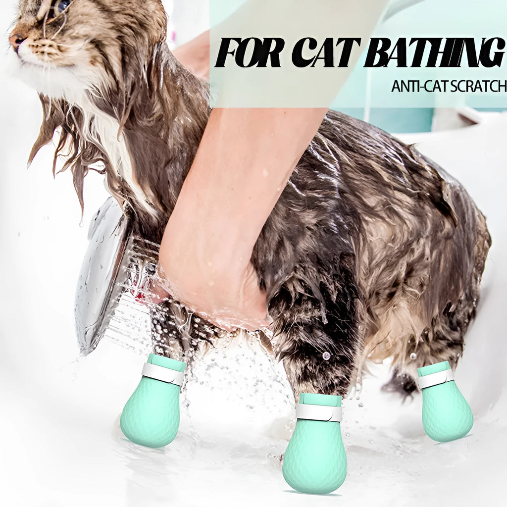 Four green silicone cat anti-scratch foot covers for paw protection during washing and handling