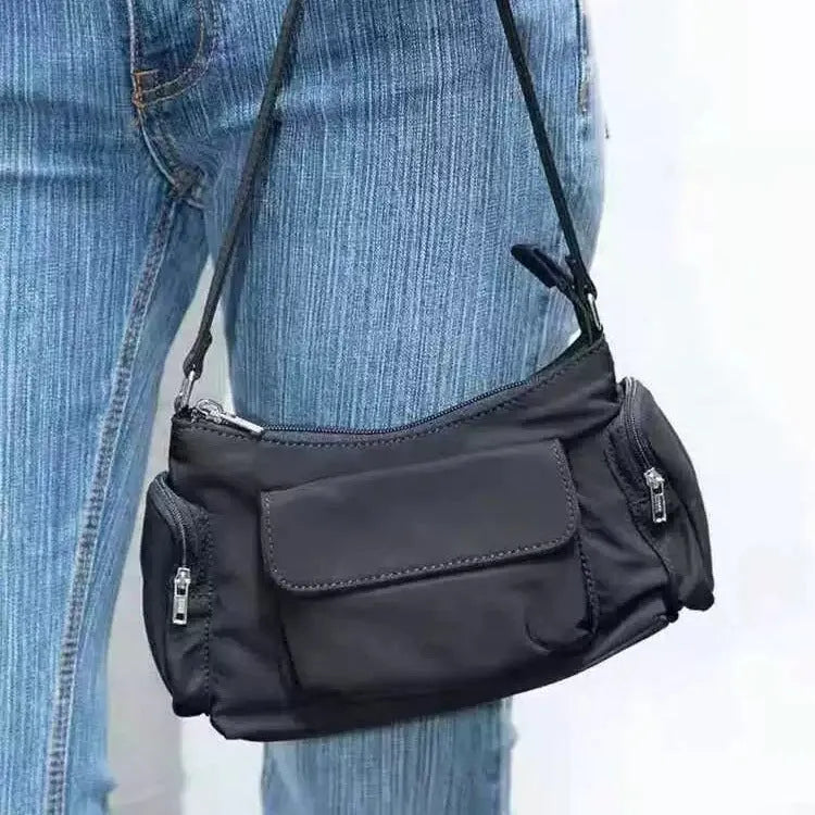 Black PU nylon double pocket shoulder bag with side line detail showing compact dimensions
