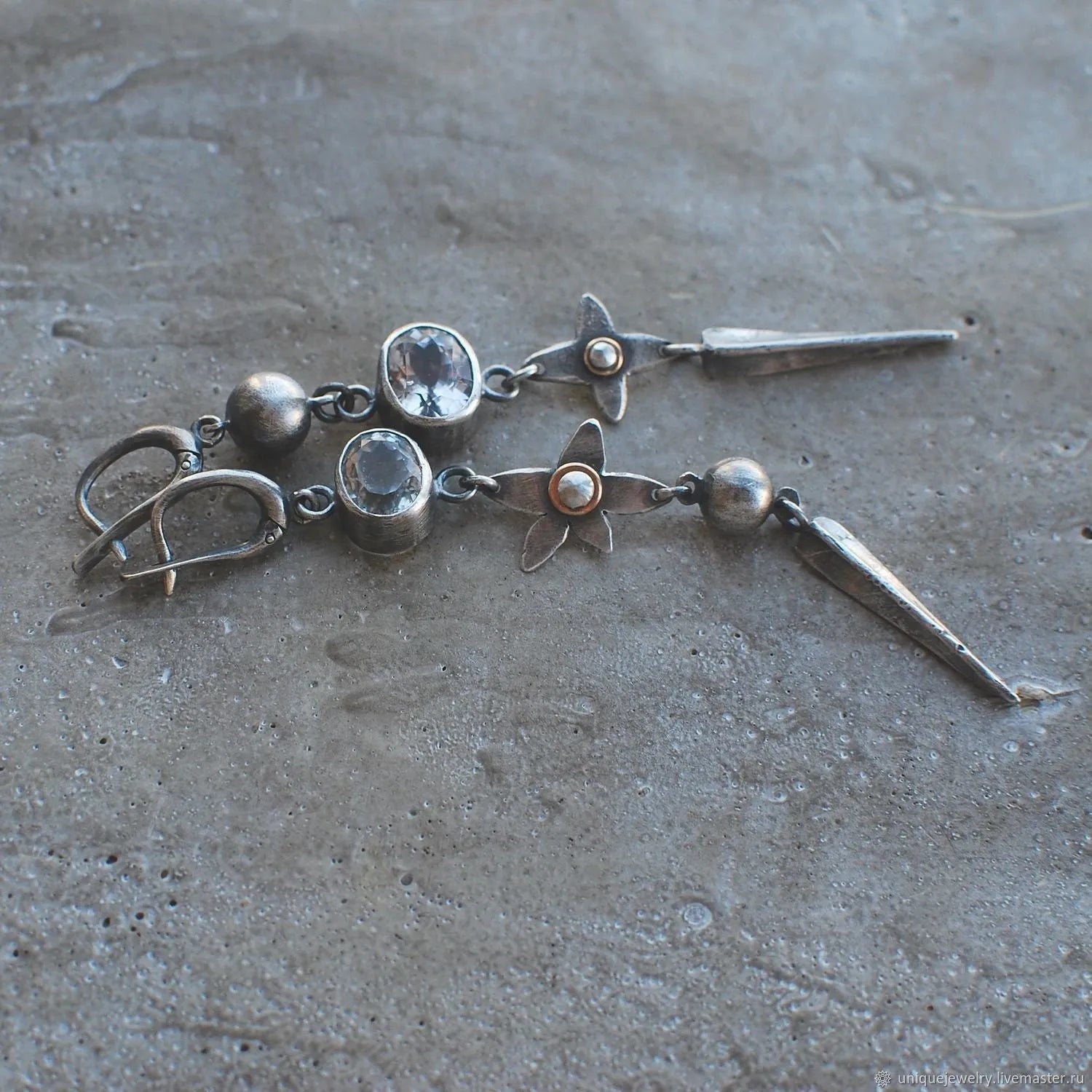 A pair of long geometric XINGX pendant earrings in antique silver with rhinestones.