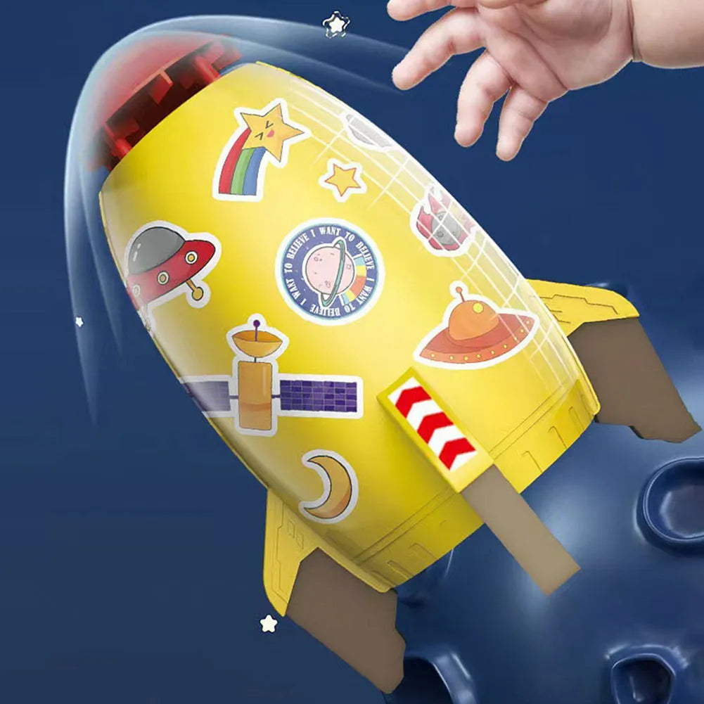 Water pressure rocket launcher toy on green grass with water spray, yellow rocket, and base connector