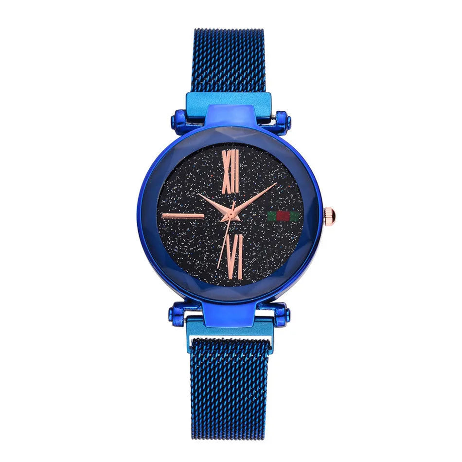 Ladies quartz wristwatch with round 32mm dial and stainless steel strap with magnetic buckle, shown in rose gold colour.