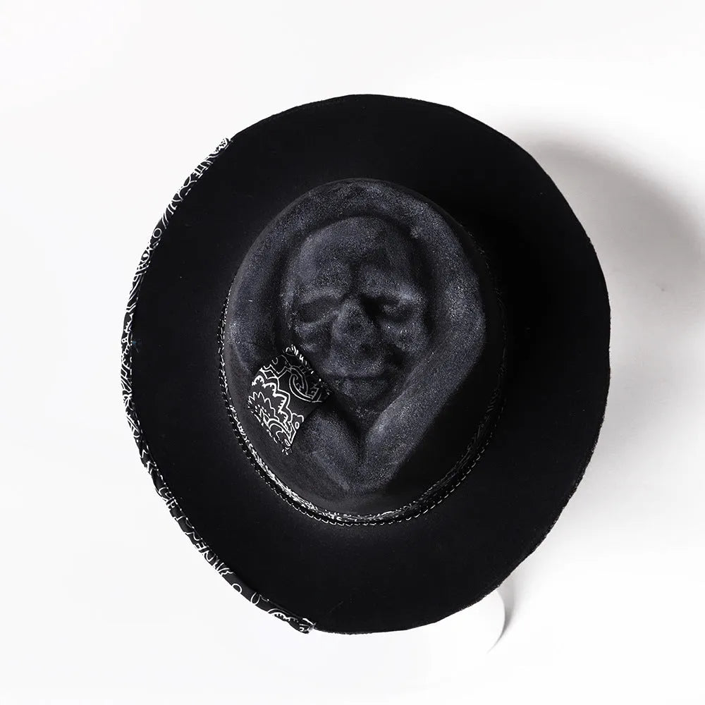 Handmade wool felt conical hat with skull design showing conical silhouette and wool texture