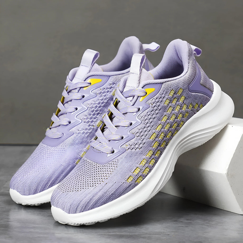 Lavender purple women's Flyknit running shoes with striped pattern, mesh lining, and a flat EVA wedge sole.