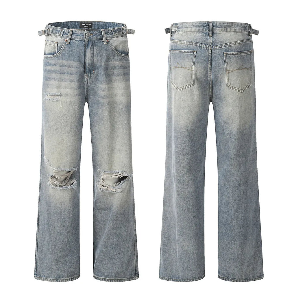 Denim blue straight-leg jeans with ripped details and zip fly closure
