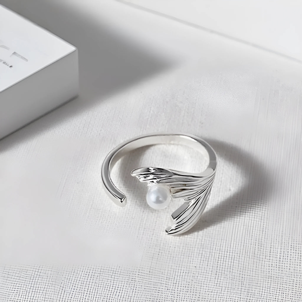 Fishtail pearl little finger ring made of electroplated alloy in free size for unisex wear.
