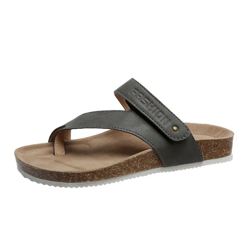 Flat toe ring thick-soled flip-flop in a solid colour on a plain background
