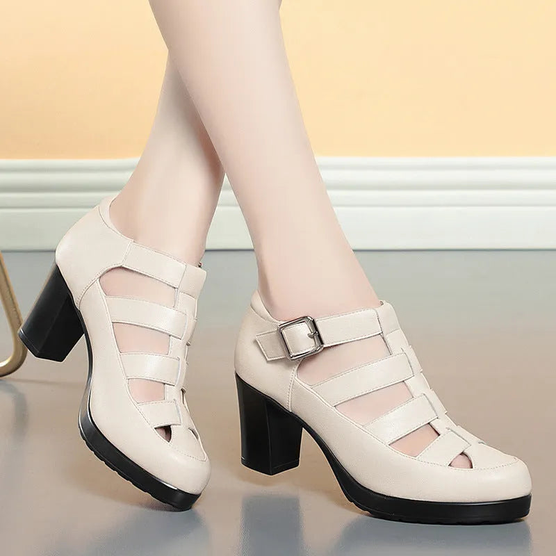 Women's beige closed toe sandals with chunky heel, ankle strap, buckle, and back zipper.