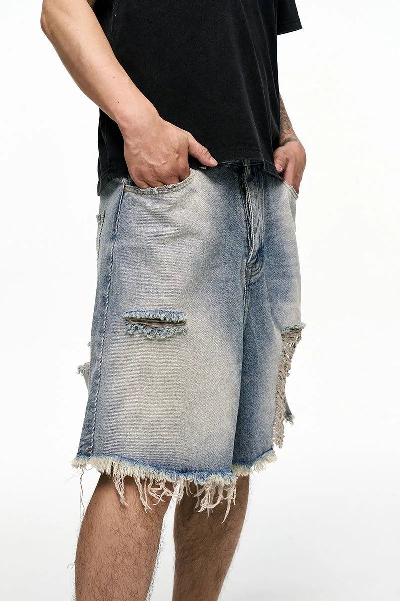 Light blue washed denim shorts with wide leg baggy fit and mid waist design