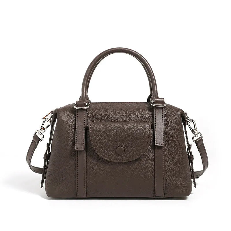 Genuine leather ladies handbag in street trend style with contrast stitching and lock detail.