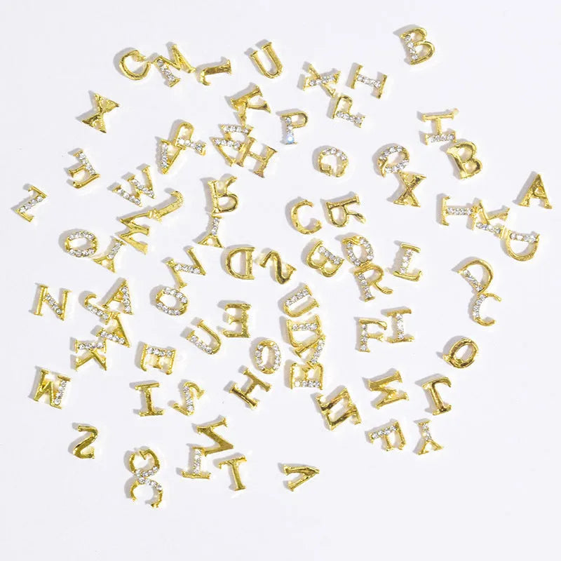 Gold alloy letter A nail ornament charm with crystal detail on a square chain base