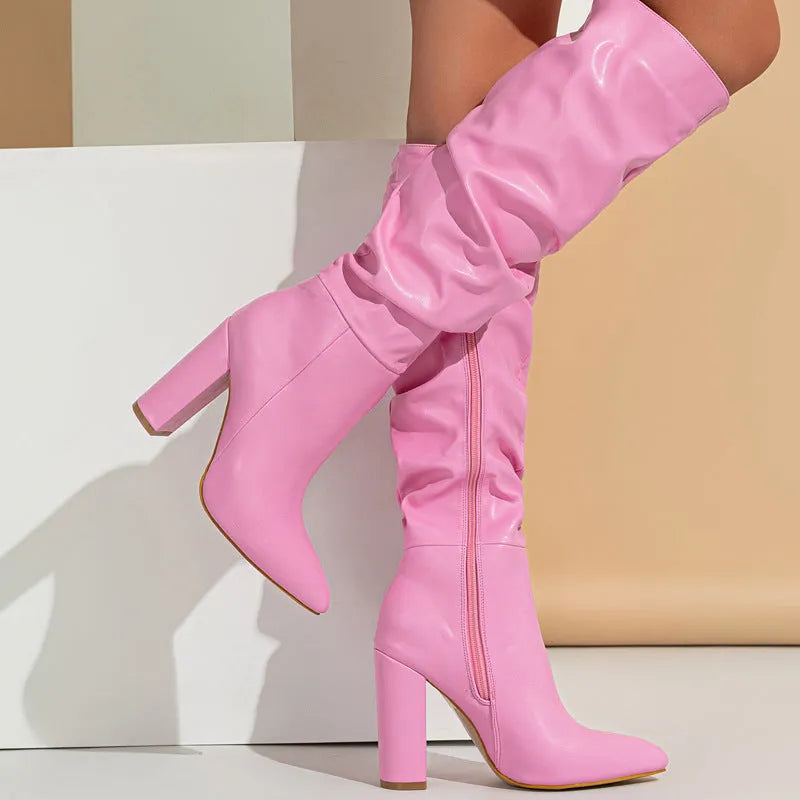 Women's long white pointed-toe high-heel boots with a side zipper, shown from the side.