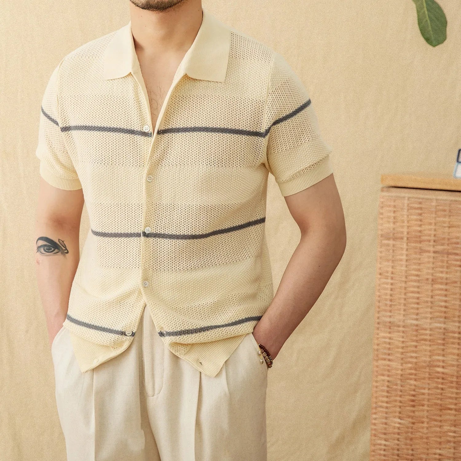 Camel coloured short sleeve knitted cardigan with lapel collar laid flat
