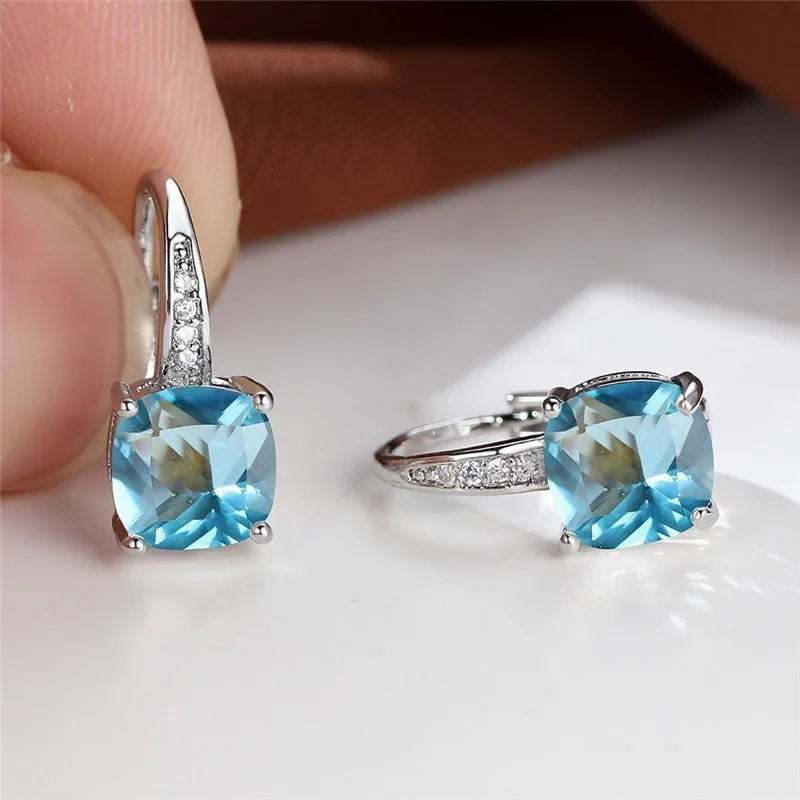 Square geometric ear hook studs with a round zircon stone, shown in a gold electroplated finish.