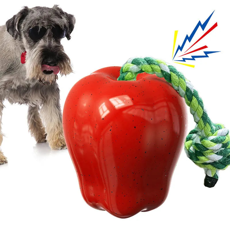 Green plastic dog toy with food dropping ball and molar shape for outdoor play