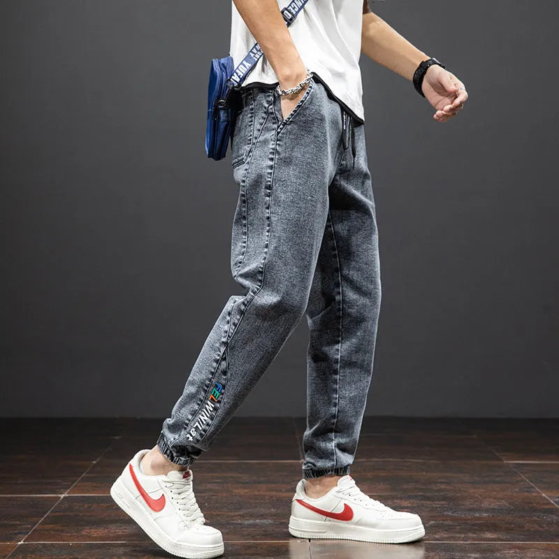 Men's cropped oversized slimming straight leg jeans in black, grey, and blue with high elasticity cotton blend