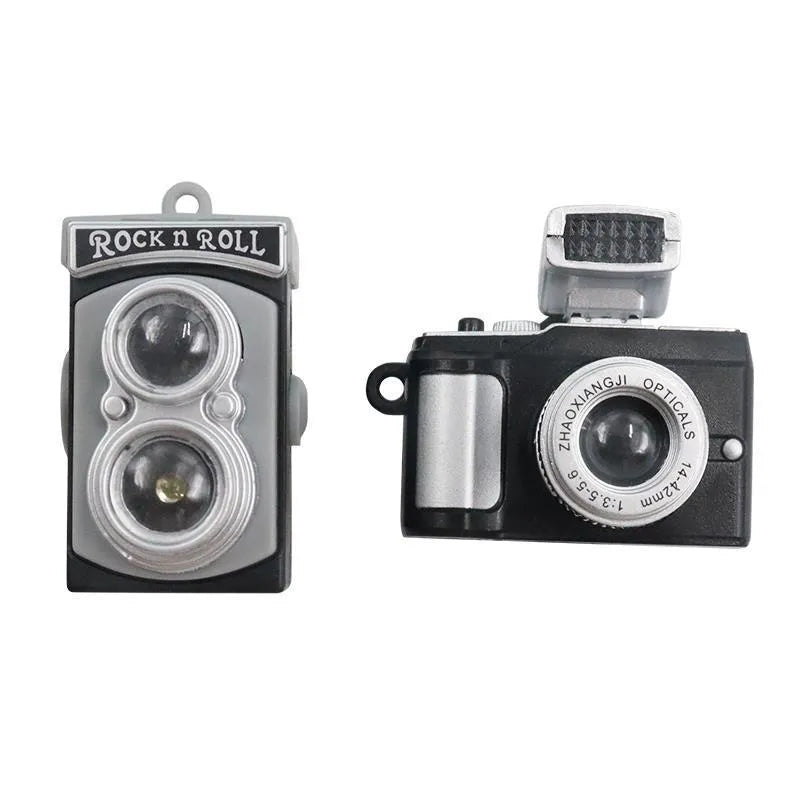 Pack of four retro camera dot design adhesive hooks for car interiors.