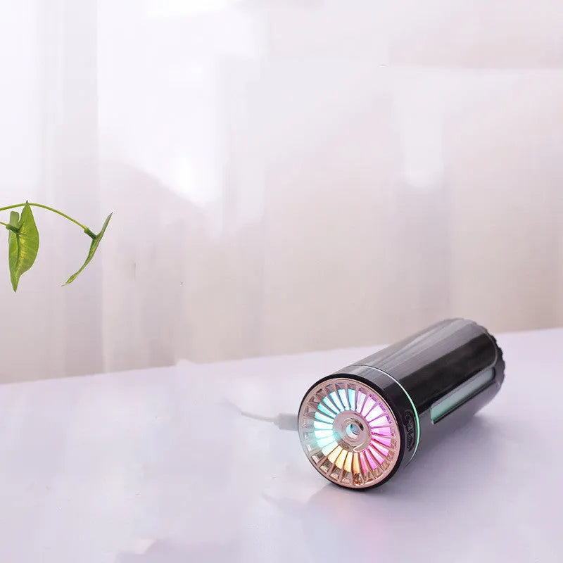 Black and white rechargeable USB humidifier with colourful lights for car and desk use.