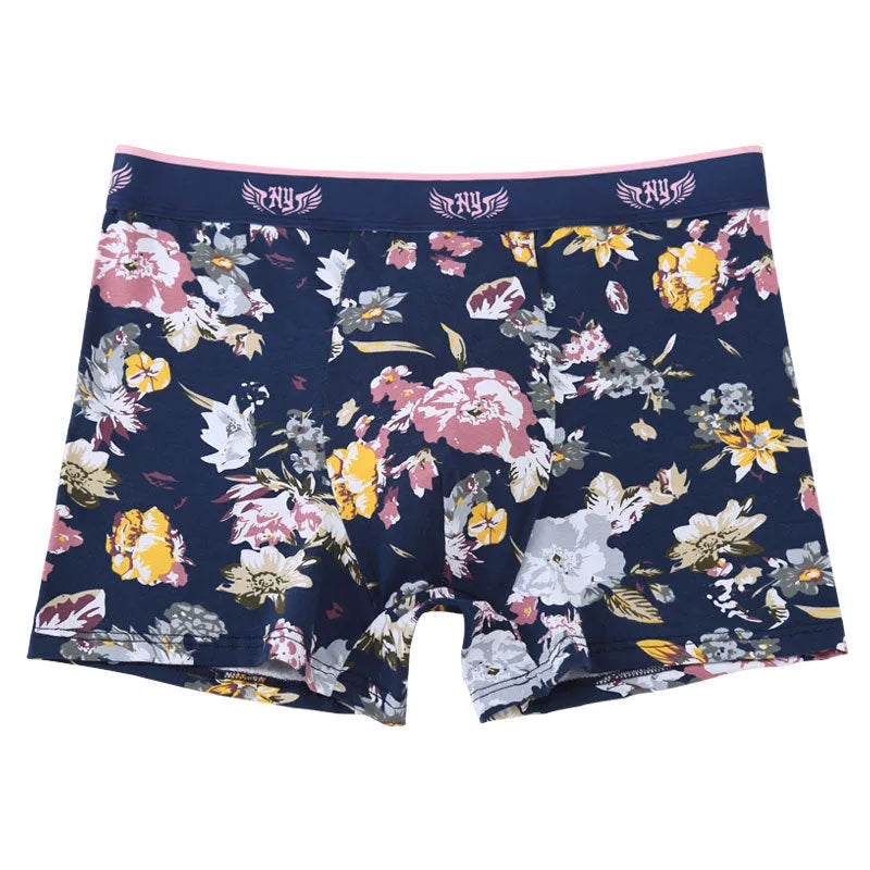 Men's floral print cotton boxer shorts showing mid-waist fit and U-shaped convex design.