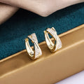 Geometric copper earrings with 14K yellow finish and zircon treatment