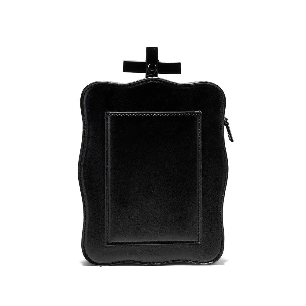 Black mini square crossbody bag with skull embroidery, decorative stitching, and metal chain details