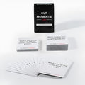 Black presentation box containing Our Time Lovers Edition communication cards for couples