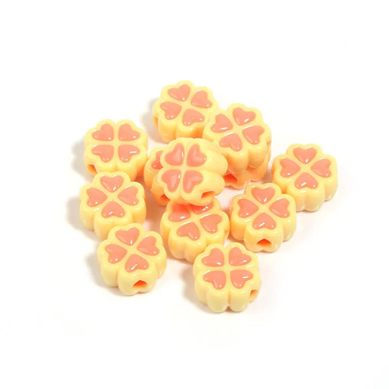 Assortment of 15mm frosted acrylic four-leaf clover beads in rose red, pink, yellow, green, blue, and purple colours.