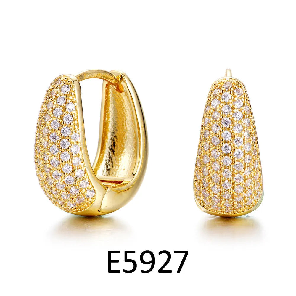 Gold plated heart shaped ear clip earrings with cubic zirconia stones on copper base